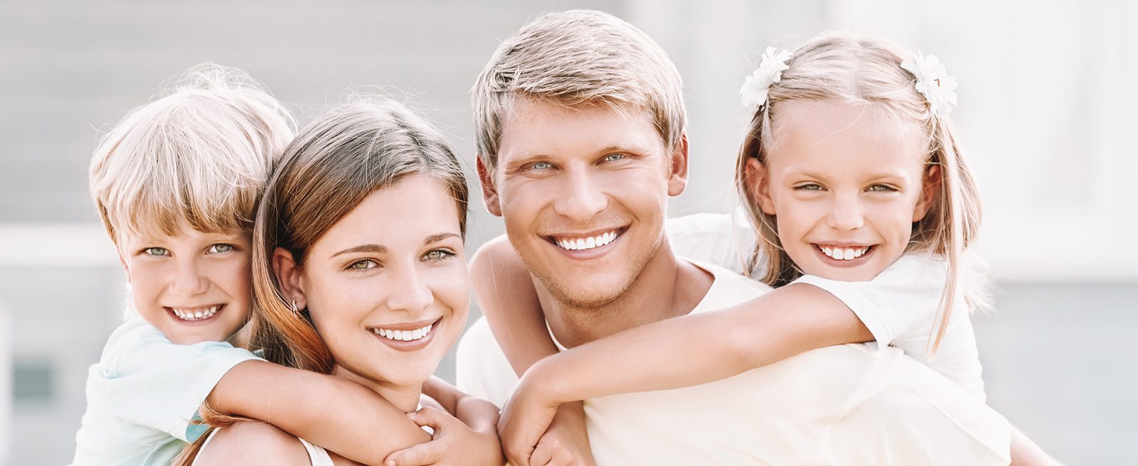 Family with two children smiling